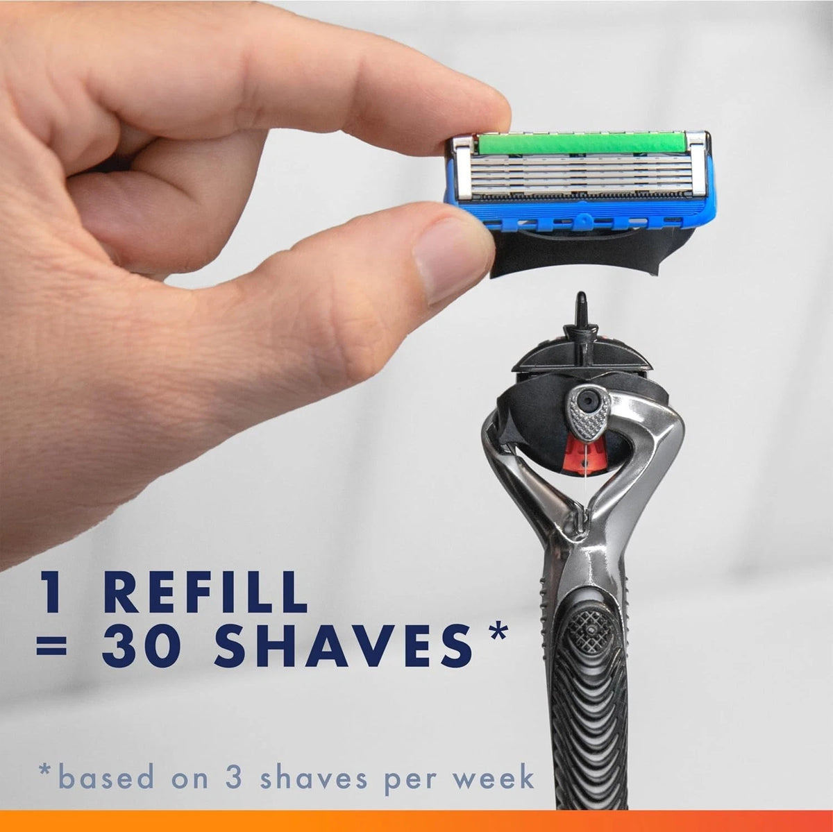 Hand holding a razor refill with a full razor below, on a white background.