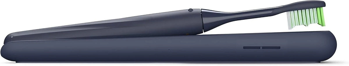 Navy blue electric toothbrush with a green bristle head on a white background