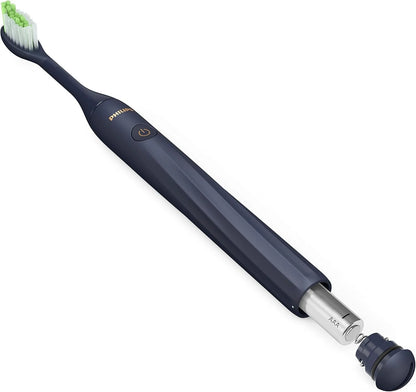 Navy blue electric toothbrush with a white background