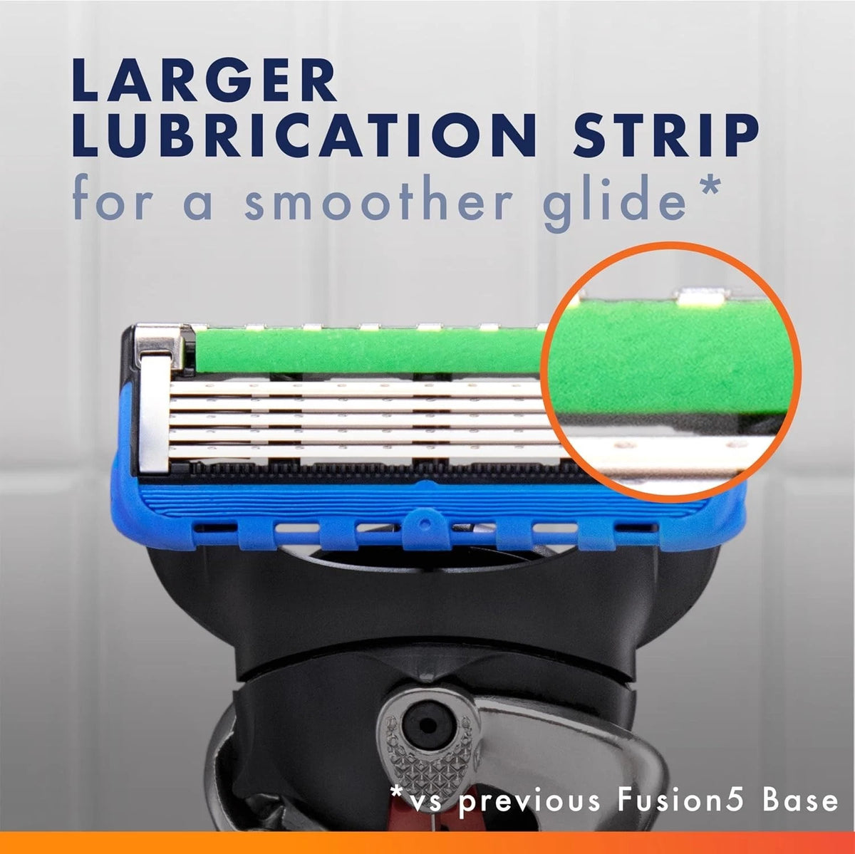 Shaving razor with a larger lubrication strip highlighted on a gray background